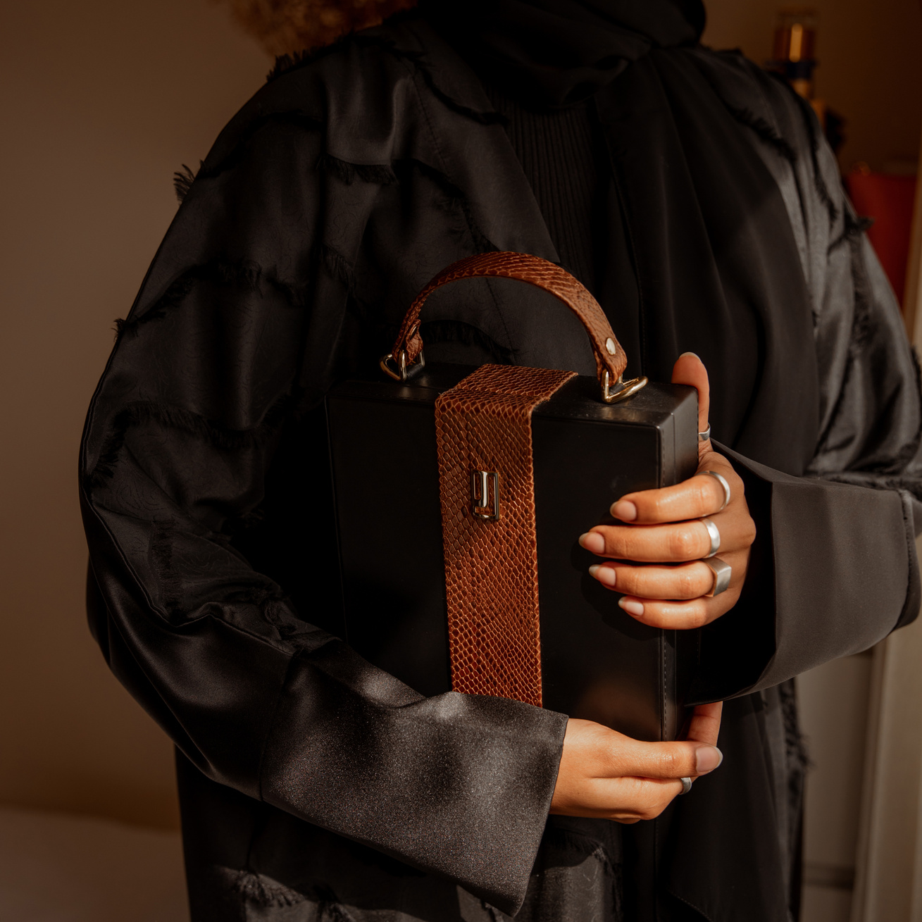 Woman in Abaya Holding Bag