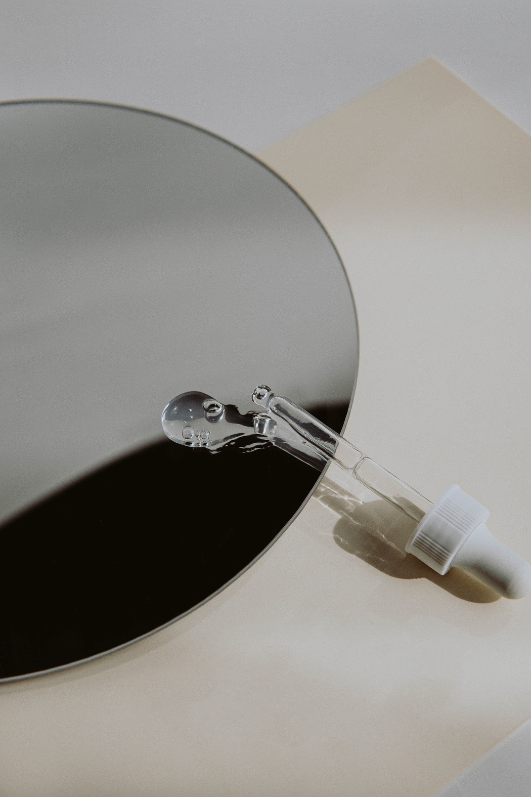 Clear Glass Light Bulb on White Table